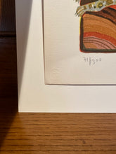 Load image into Gallery viewer, Framed artwork with a signature on a wooden surface