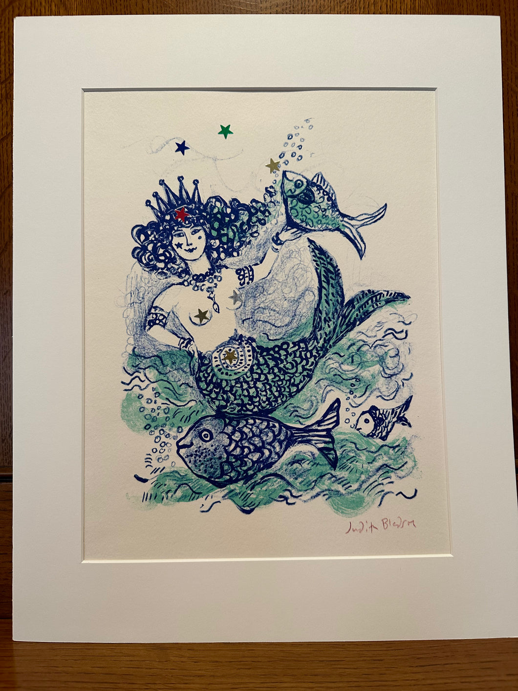 Matted artwork of a mermaid with a seahorse and fish on a white background