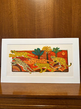 Load image into Gallery viewer, Artistic depiction of leopards on a decorative background with a wooden surface.
